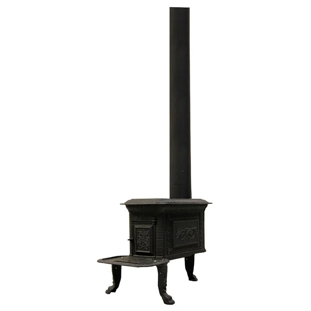 A cast iron stove with a long stove pipe coming out of the top.