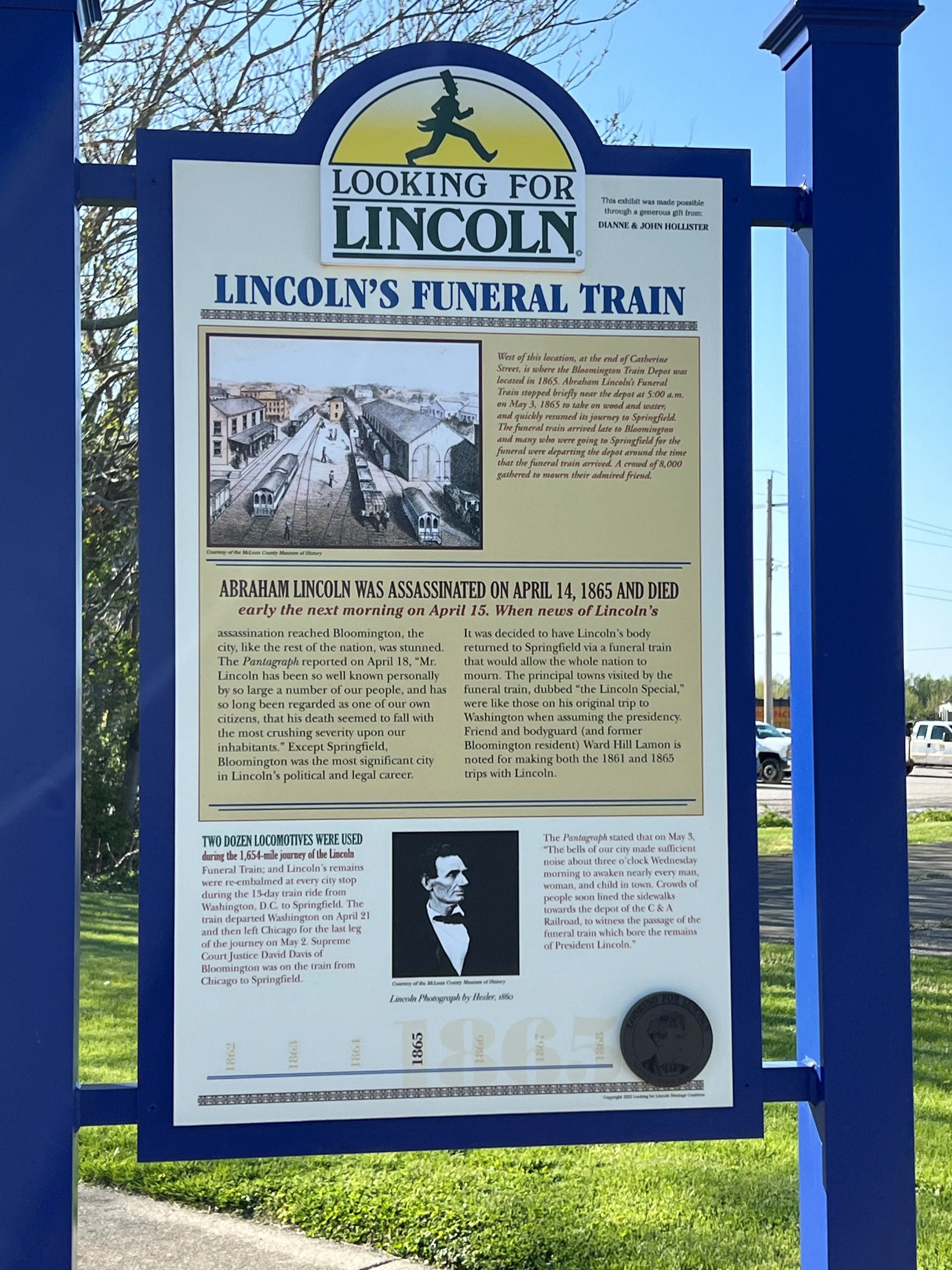 A blue and white historical marker titled 
