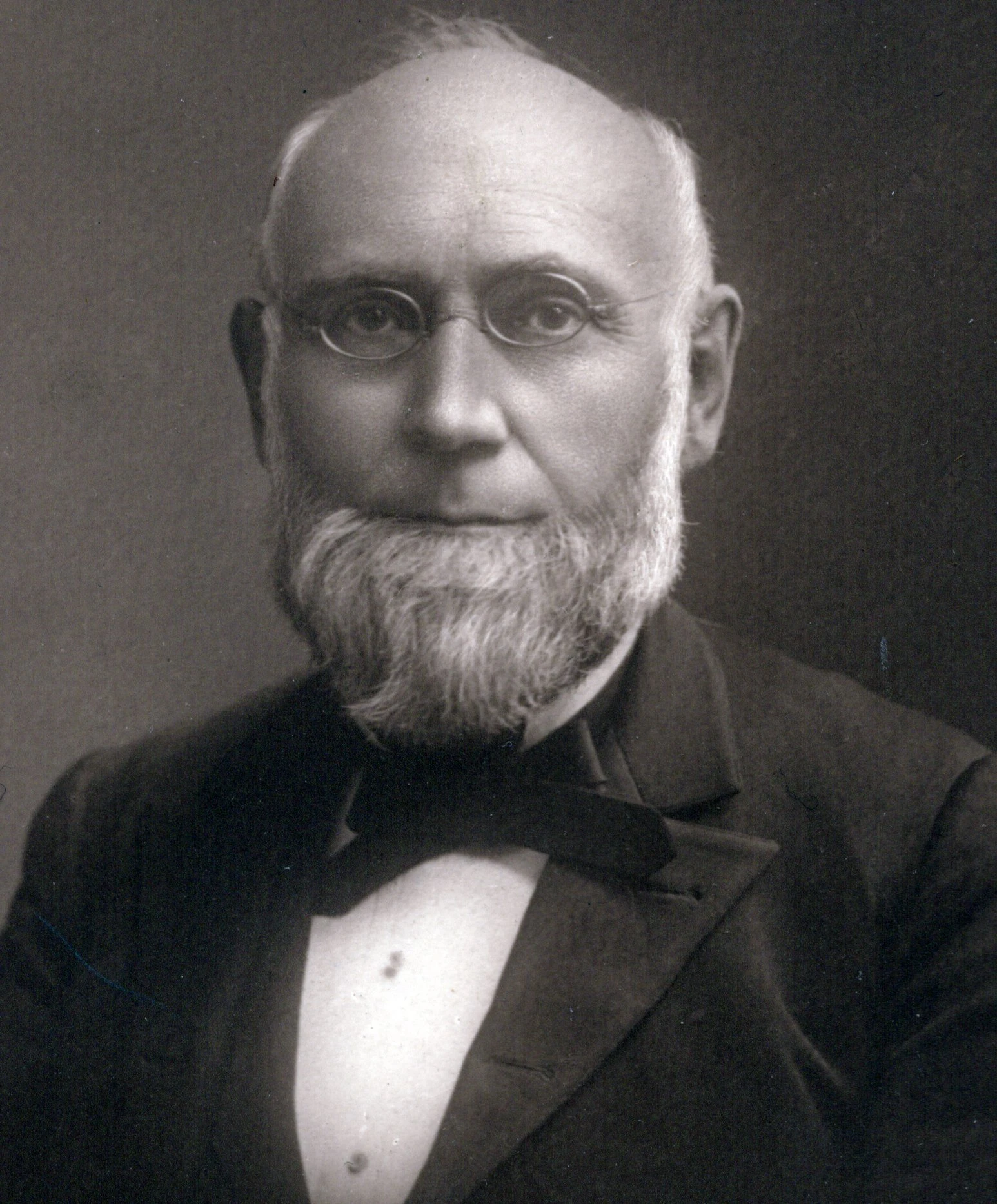 white man with a beard and glasses