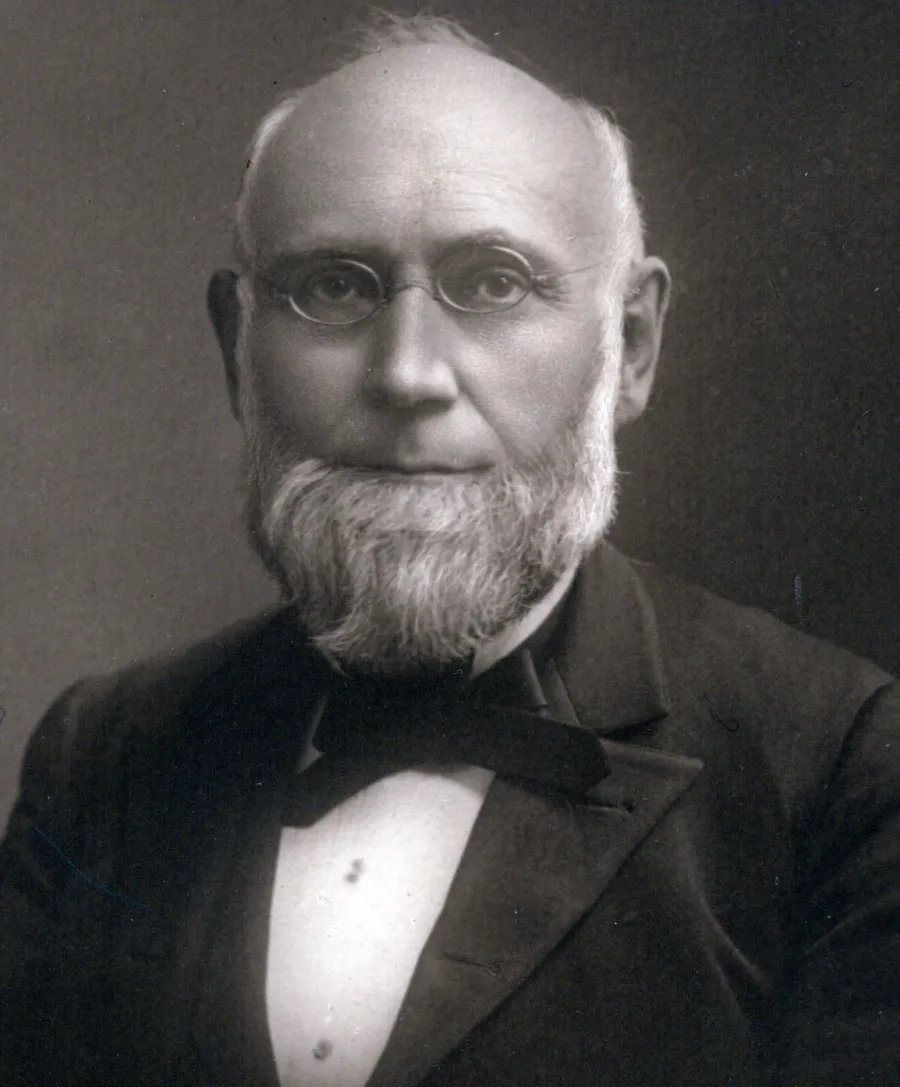 white man with a beard and glasses