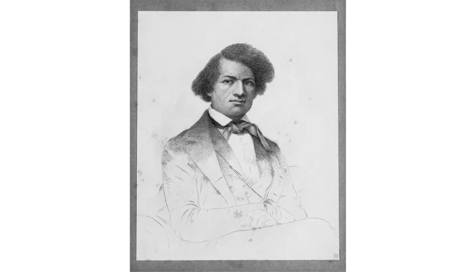Black and white portrait of a Black man with curly dark hair, wearing a formal double-breasted coat and bow tie, seated and gazing toward the viewer with a composed expression.