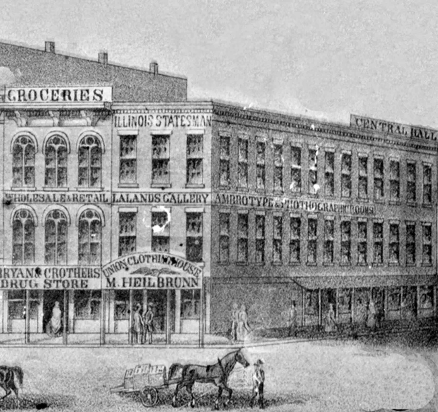 Black and white historical engraving of a multi-story commercial building with storefronts at street level, including businesses such as Bryan's Drug Store, M. Heilbrunn clothing house, and various other establishments.